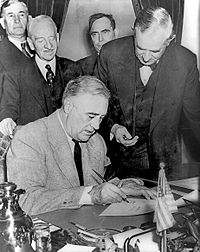 Franklin Roosevelt signing declaration of war against Germany