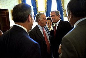 President George W. Bush meets with Senator Paul Sarbanes and Secretary of Labor Elaine Chao