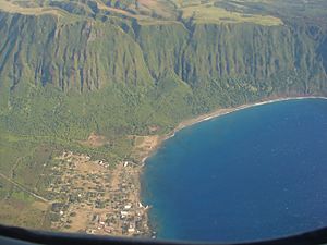 Most of the village of Kalaupapa as seen from an airplane. This photo also includes a section of the sea cliffs that form a natural barrier between the Kalaupapa Peninsula and "Topside" Molokaʻi.