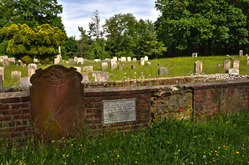 Cemetery plot with gravestone visibly missing