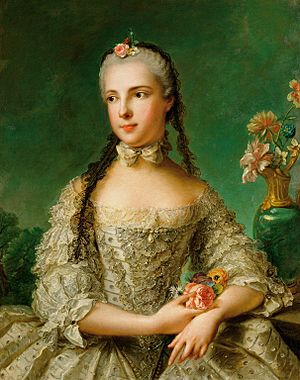 Isabella wears an ornate silver dress, with a white bow around her neck. Her short hair is powdered white, with black lace braided into it and a pink rose on top of her head. She is looking into the distance and holding flowers.