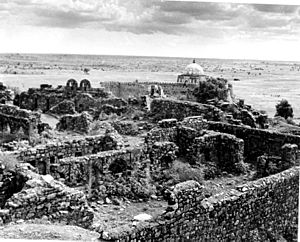 Ruins of Tughlaqabad Fort with Ghiyas-ud-din’s tomb in the background 1949