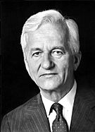 Formal photograph of Richard von Weizsäcker wearing a jacket and tie with a black background.
