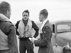 Squadron Leader Brian 'Sandy' Lane, CO of No. 19 Squadron (centre) confers with Flight Lieutenant Walter 'Farmer' Lawson and Flight Sergeant George 'Grumpy Unwin at Fowlmere near Duxford, September 1940. CH1366.jpg