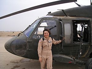 Tammy Duckworth stands by her UH-60 Blackhawk helicopter (001130-A-FI215-212)