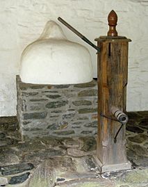 Beehive oven and pump at wall house