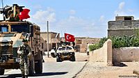 Turkish soldiers conduct patrol on outside Manbij, Syria