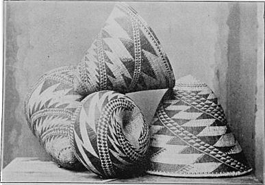Stack of four baskets with zigzag pattern and conical shape