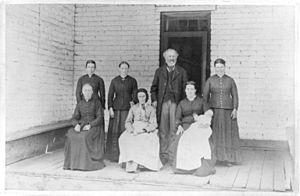 A Latter Day Saint with five wives and his mother (posed on porch) LCCN2003663781