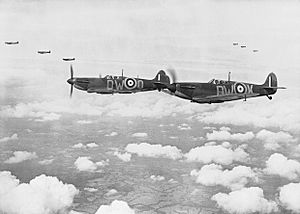 Supermarine Spitfire Mark Is of No. 610 Squadron based at Biggin Hill, flying in 'vic' formation, 24 July 1940. CH740
