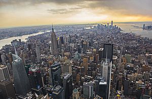 Midtown Manhattan, the world's largest central business district, in the foreground, with Lower Manhattan and its Financial District in the background