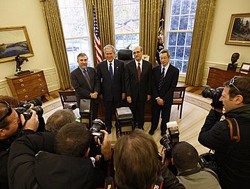 President George W. Bush poses for a photo with Nobel Prize winners Monday, Nov. 24, 2008