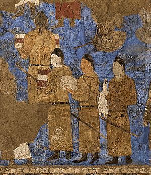 Tang Dynasty emissaries at the court of Varkhuman in Samarkand carrying silk and a string of silkworm cocoons, 648-651 CE, Afrasiyab murals, Samarkand