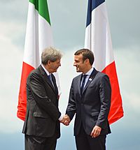 G7 Taormina Paolo Gentiloni Emmanuel Macron handshake 2017-05-26 (cropped)