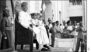 Muhammad Ali Jinnah sitting on the Chair of Governer General wearing a Sherwani
