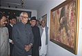 The Vice President of India, Shri Bhairon Singh Shekhawat looking at painting works by the former Prime Minister Shri V. P. Singh, after inaugurating the exhibition, in New Delhi on February 14, 2006