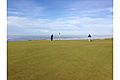 Golfers on the 16th green at Bandon Dunes