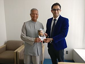 Noble Laureate Prof Muhammad Yunus receiving the book by Dr Edmond Fernandes