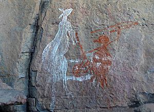 Rock painting of a hunter with a Kangaroo