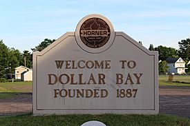 Welcome sign for Dollar Bay