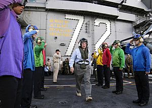 US Navy 050115-N-4166B-025 Deputy Secretary of Defense Paul Wolfowitz departs USS Abraham Lincoln (CVN 72) after visiting with the ship and her crew to discuss and congratulate their humanitarian efforts in Sumatra, Indonesia