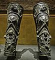 Ornate pair of gladiator shin guards depicting a procession of Bacchus from the gladiator barracks in Pompeii 01