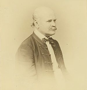 An engraved portrait of Semmelweis: a mustachioed, balding man in formal attire, pictured from the chest up.