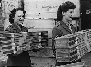 Women of the Auxiliary Territorial Service unload rifles