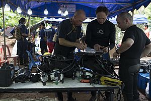 4547292 Cave rescue divers prepare dive equipment at Tham Luang cave