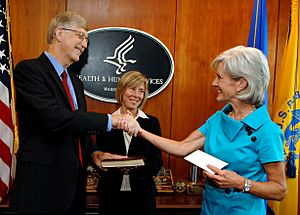 Francis Collins with Kathleen Sebelius after swearing-in ceremony
