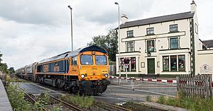 Freight train at level crossing in Coalville, July 2016
