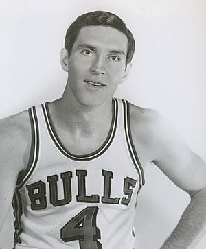 Sloan wearing a basketball uniform