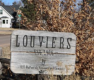 A sign marking the entrance to Louviers.