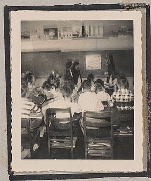 Photograph of a classroom full of students observing a poster on a chalkboard wall, Clarkesville, Habersham County, Georgia, 1950 - DPLA - ba8ec93afeaf5eca394e0c8b9142af00-004