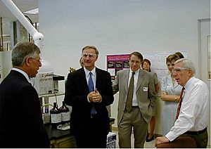Frank Wolf and Asa Hutchinson tour a DEA drug testing facility in Northern Virginia
