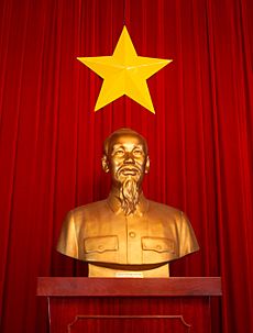 Ho Chi Minh statue and flag of Vietnam