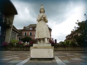 Statue of Marie Harel in white stone