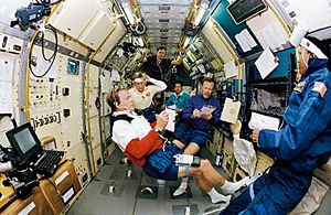 STS-47 crew in SLJ make notes during shift changeover