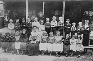 StateLibQld 2 297119 Mount Barney State School children with teacher Miss Bedelia Brennan, 1901