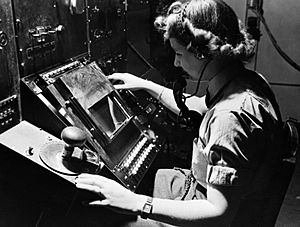 WAAF radar operator Denise Miley plotting aircraft on a cathode ray tube in the Receiver Room at Bawdsey 'Chain Home' station, May 1945. CH15332
