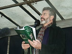 Gerry Adams reading into mic