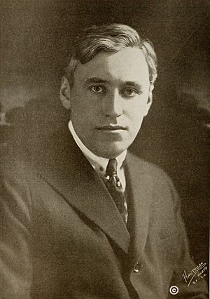 Black and white portrait photograph of Mack Sennett in 1916. He is dressed in a jacket, shirt and tie and is looking into the camera.