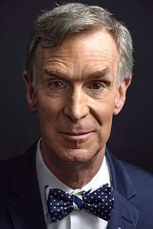 A close-up shot of Bill Nye's face, wearing one of his trademark bow ties.