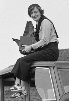 Dorothea Lange atop automobile in California (restored) (cropped)