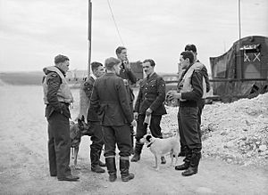 Spitfire pilots of No. 19 Squadron RAF gather at Manor Farm, Fowlmere, near Duxford in Cambridgeshire, September 1940. CH1370