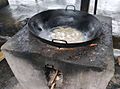 Cooking with a wok on an outdoor stove 2