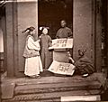 Manchu women being sold hair ornaments. John Thomson. China, 1869. The Wellcome Collection, London