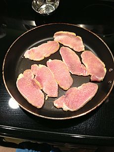 Peameal bacon in a pan