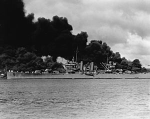 USS Phoenix (CL-46) steams down the channel at Pearl Harbor on 7 December 1941 (NH 50766)