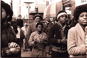 Members of Peoples Temple attend an anti-eviction rally at the International Hotel, San Francisco - January 1977